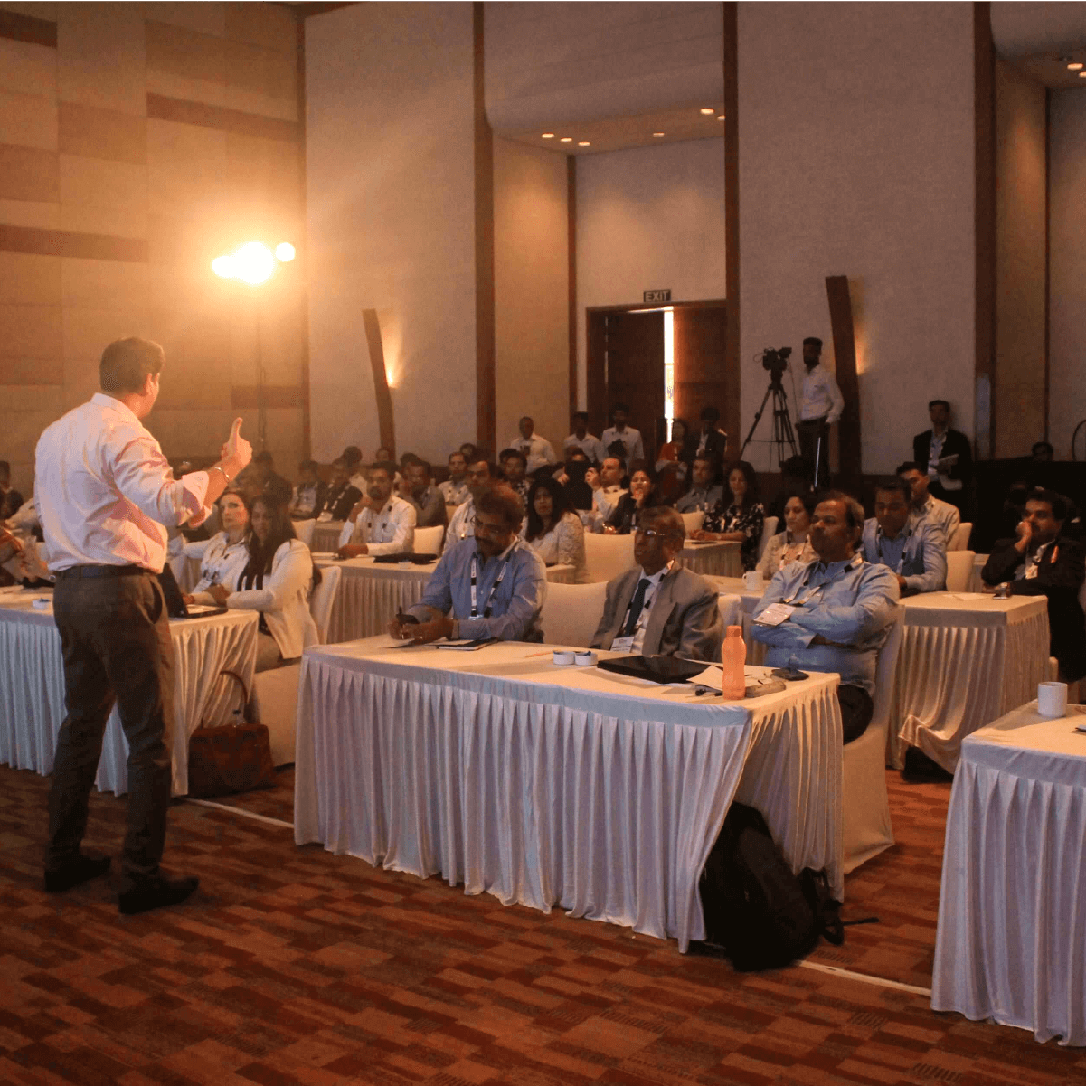 Amit Jadhav engaging with corporate professionals during a keynote speech