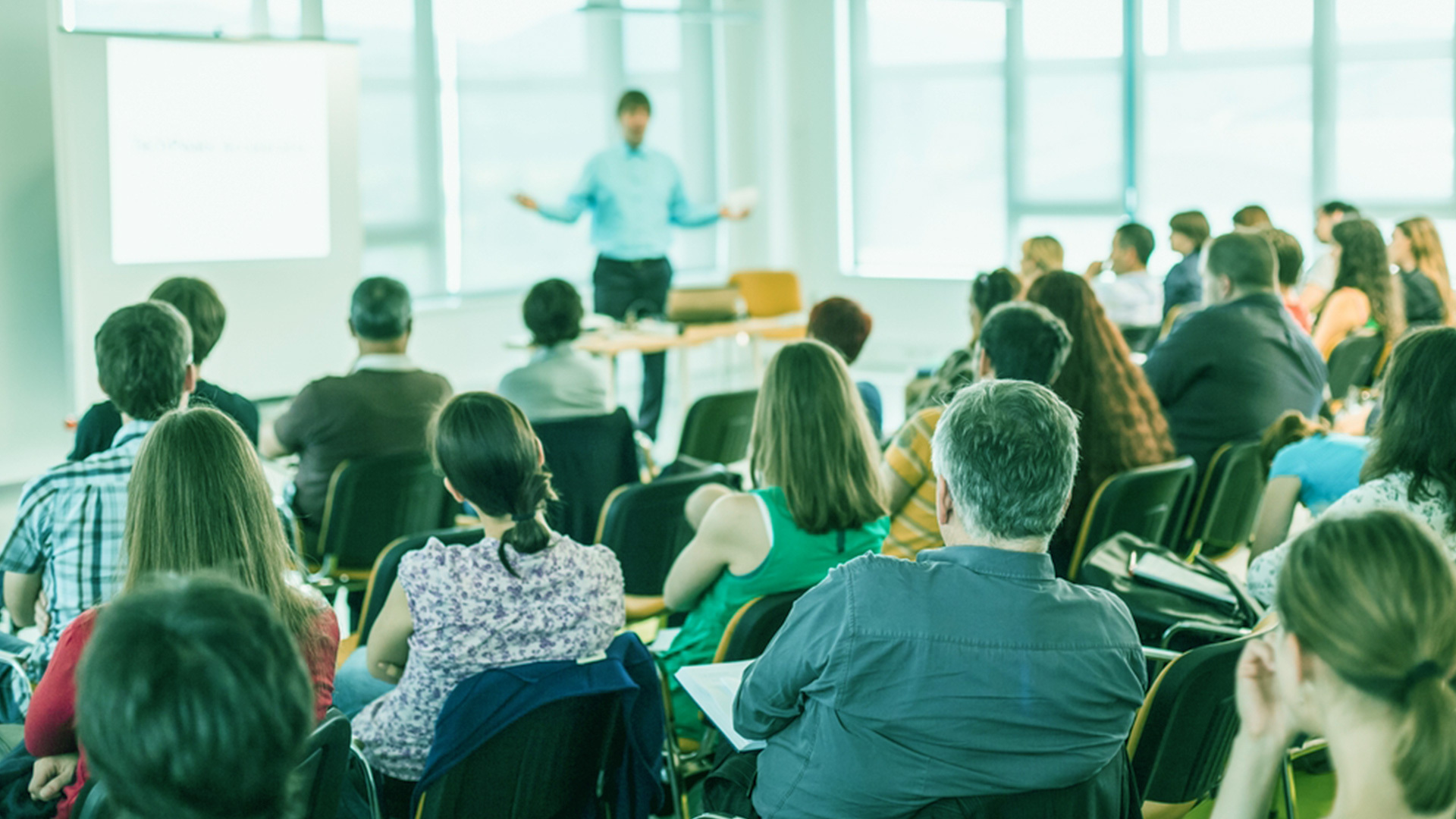 Speaker interacting with an engaged audience at a conference